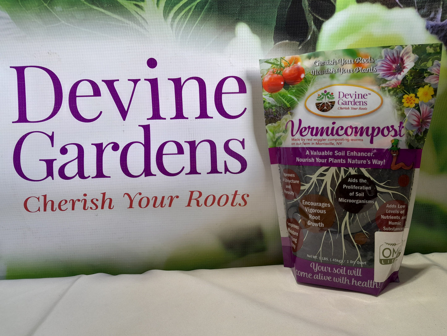 One quart bag of Devine Gardens vermicompost worm castings in front of logo